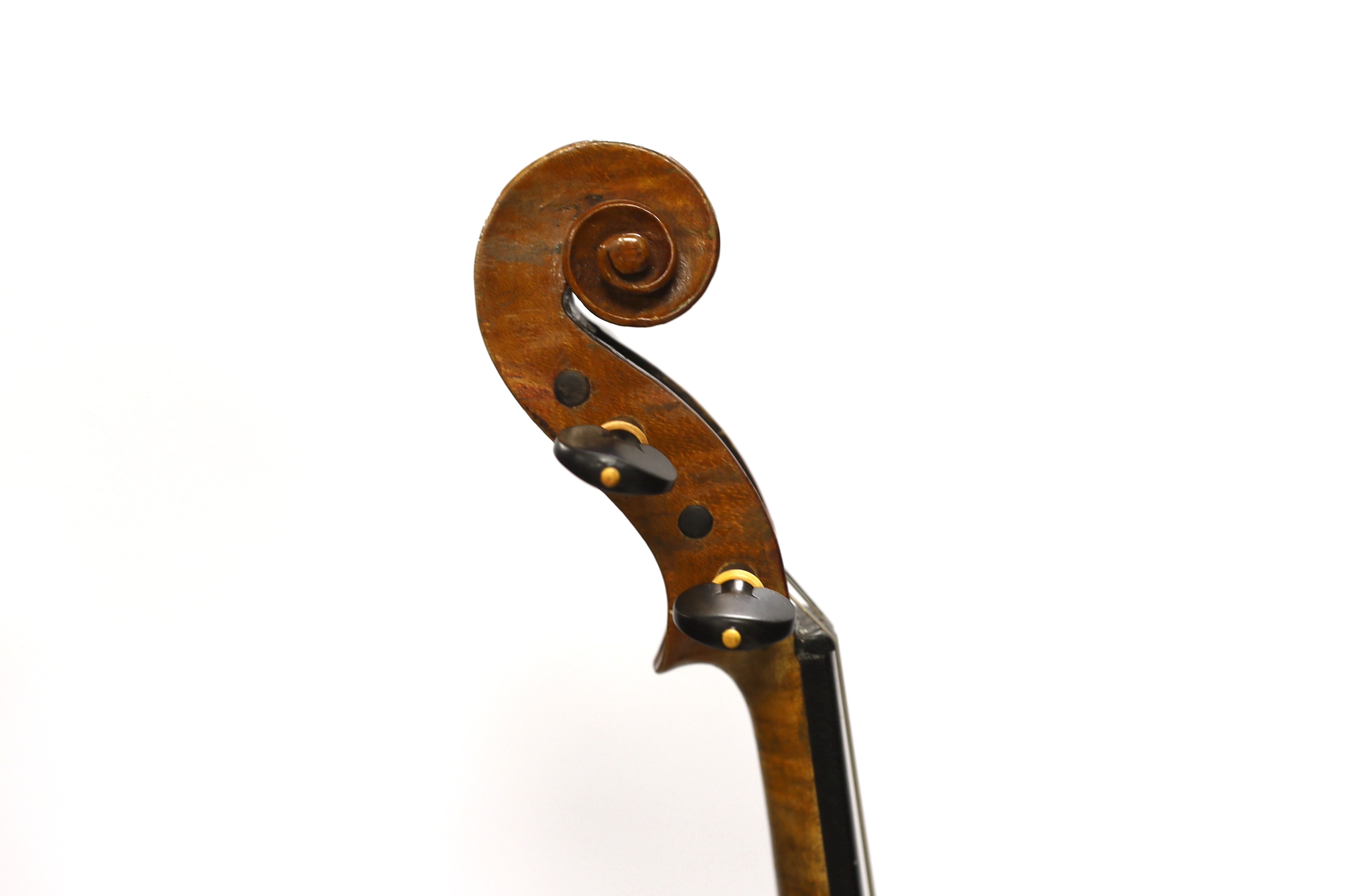 A late nineteenth century English violin by Hidalgo with a label inside the body showing a crown over Hidalgo, with a bow in an ebonised wooden case, body 36cm